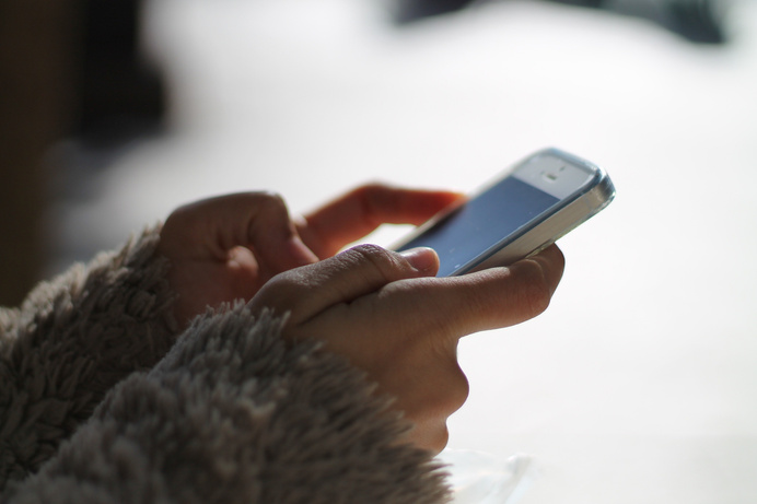 Hands Holding a Smartphone