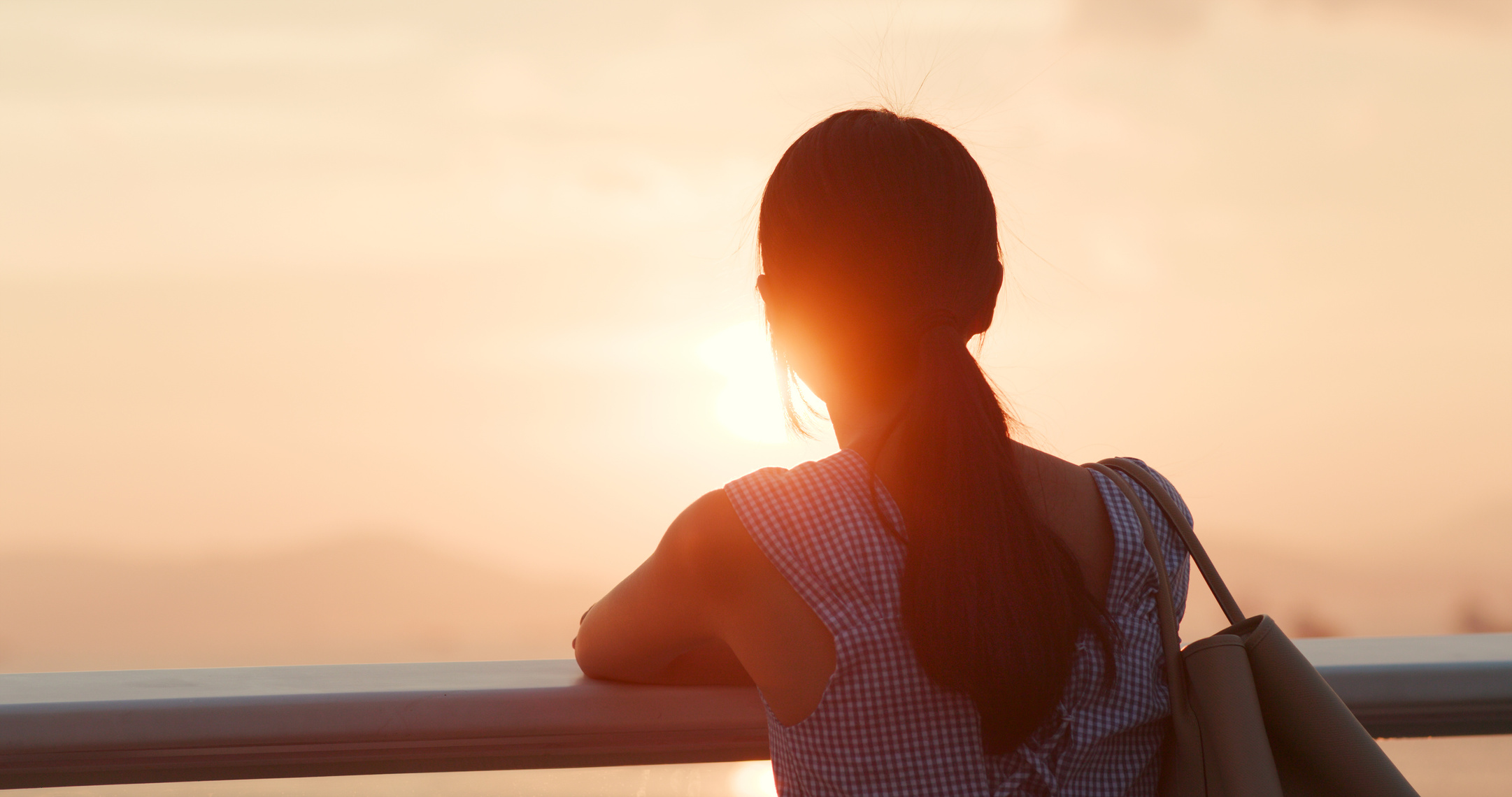 Woman Looking at the Sunset